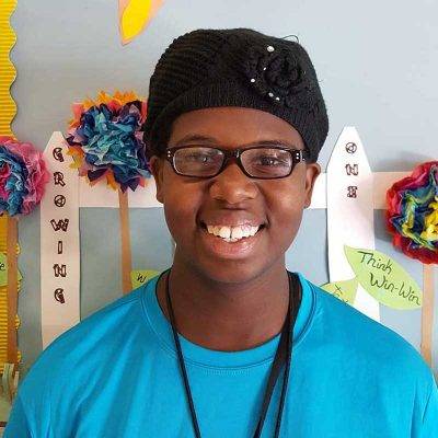 Child that is smiling at the camera