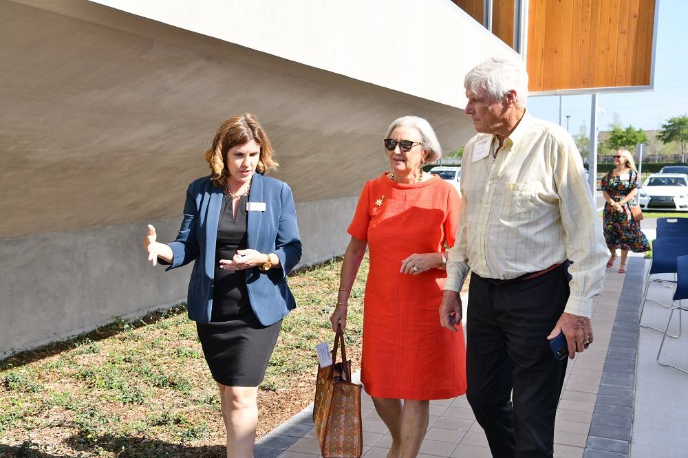 Kelly Krupp (left) gives a campus tour to Rose-Marie van Otterloo and Eijk van Otterloo