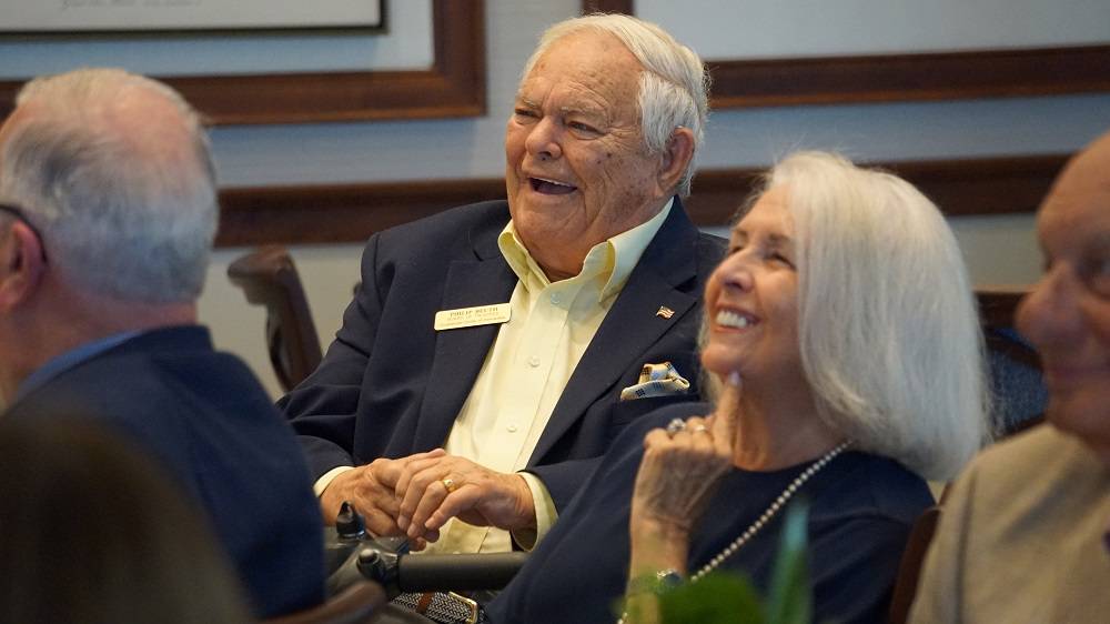 phil and mary beuth watch a video recapping their involvement with guadalupe center