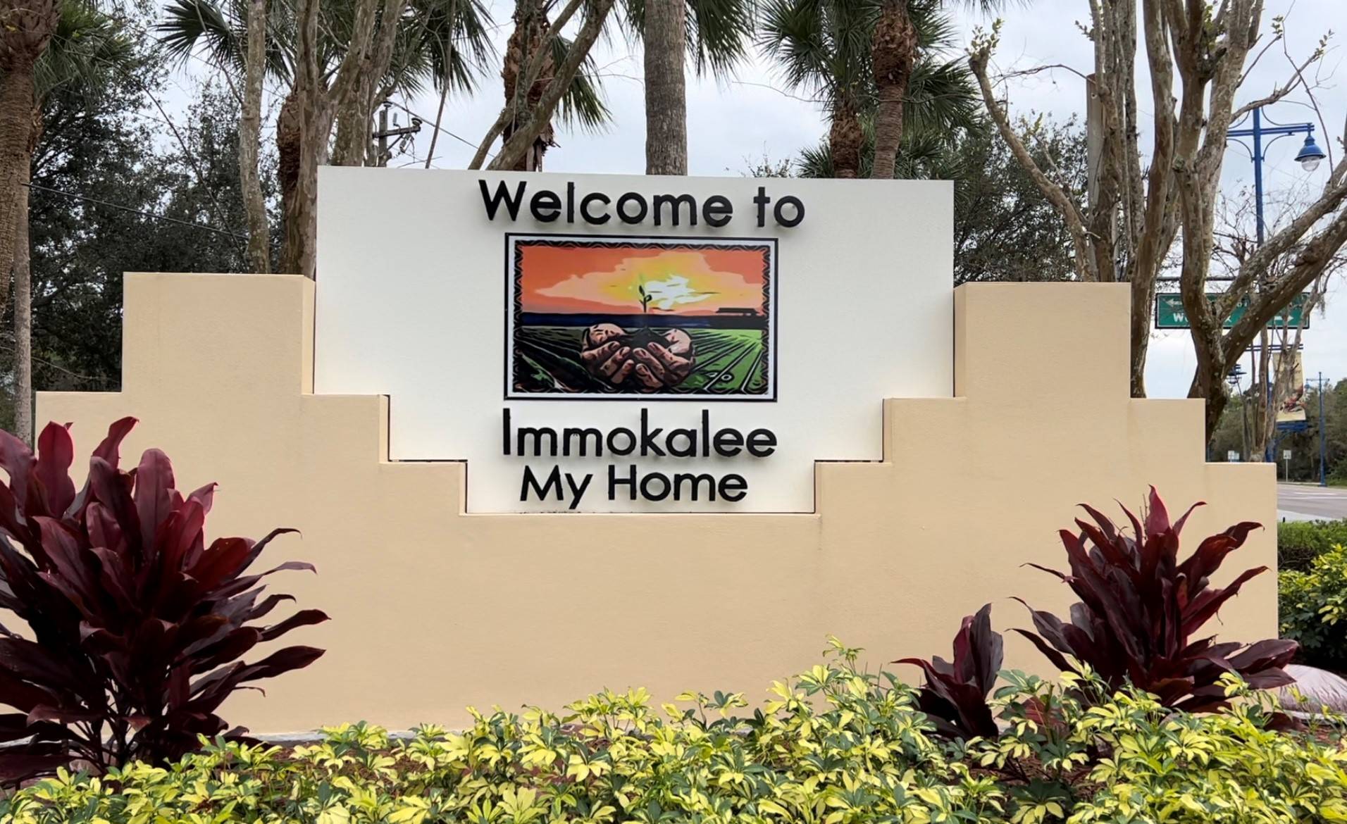 'welcome to immokalee' sign